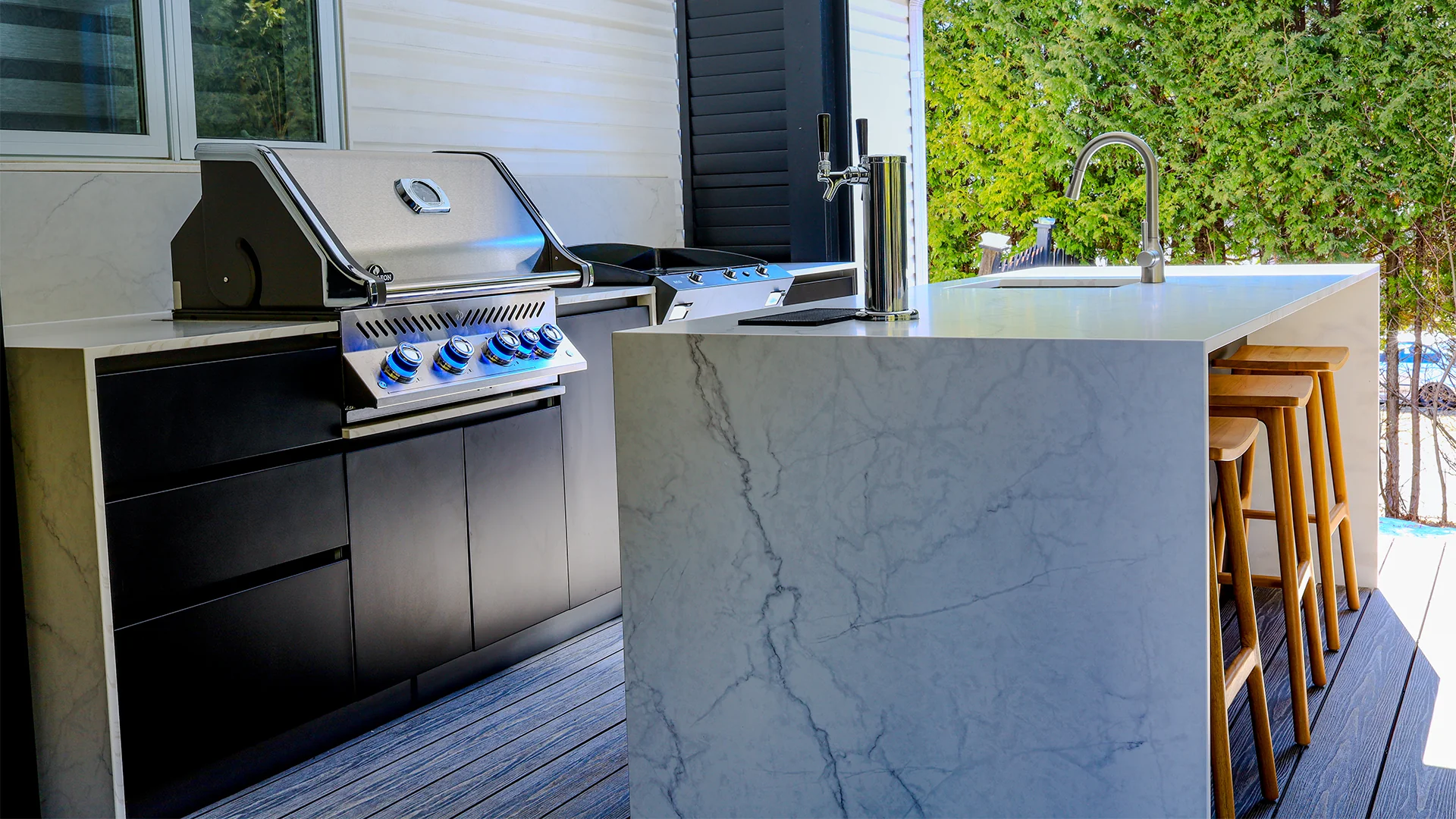 Harvey Project, outdoor kitchen with built-in BBQ, sink, and bar area
